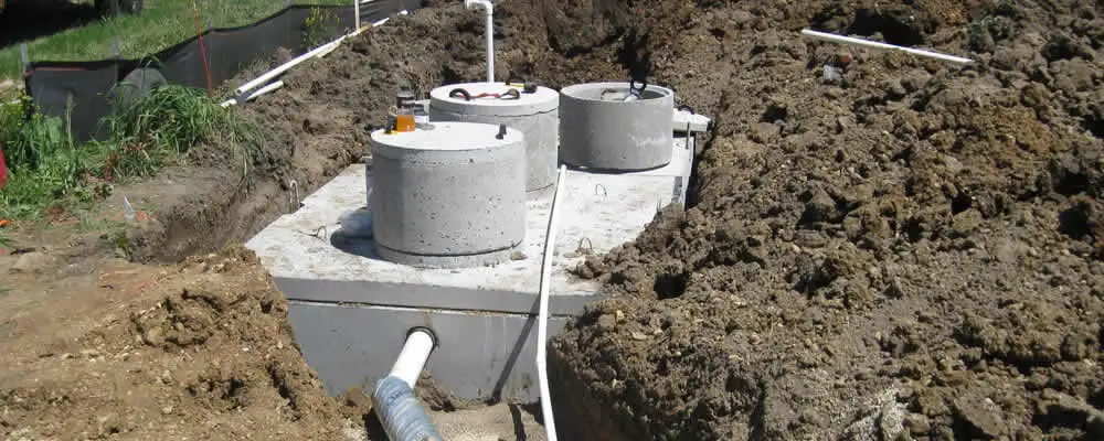 Septic system repair and installation site with tank access ports in Lexington, MA
